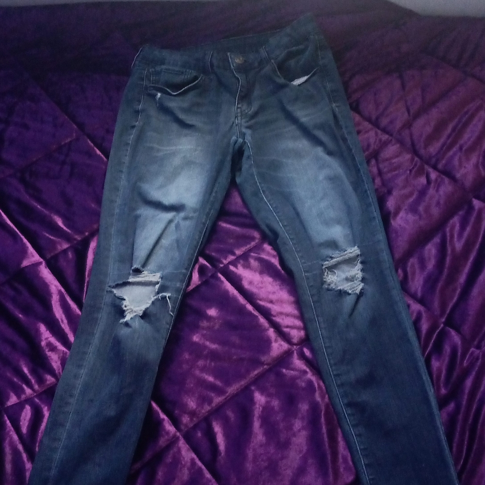 ripped dark blue jeans
